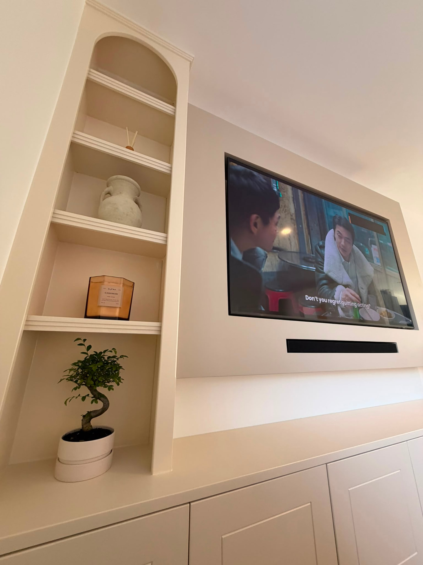 Cream arched bespoke media wall
