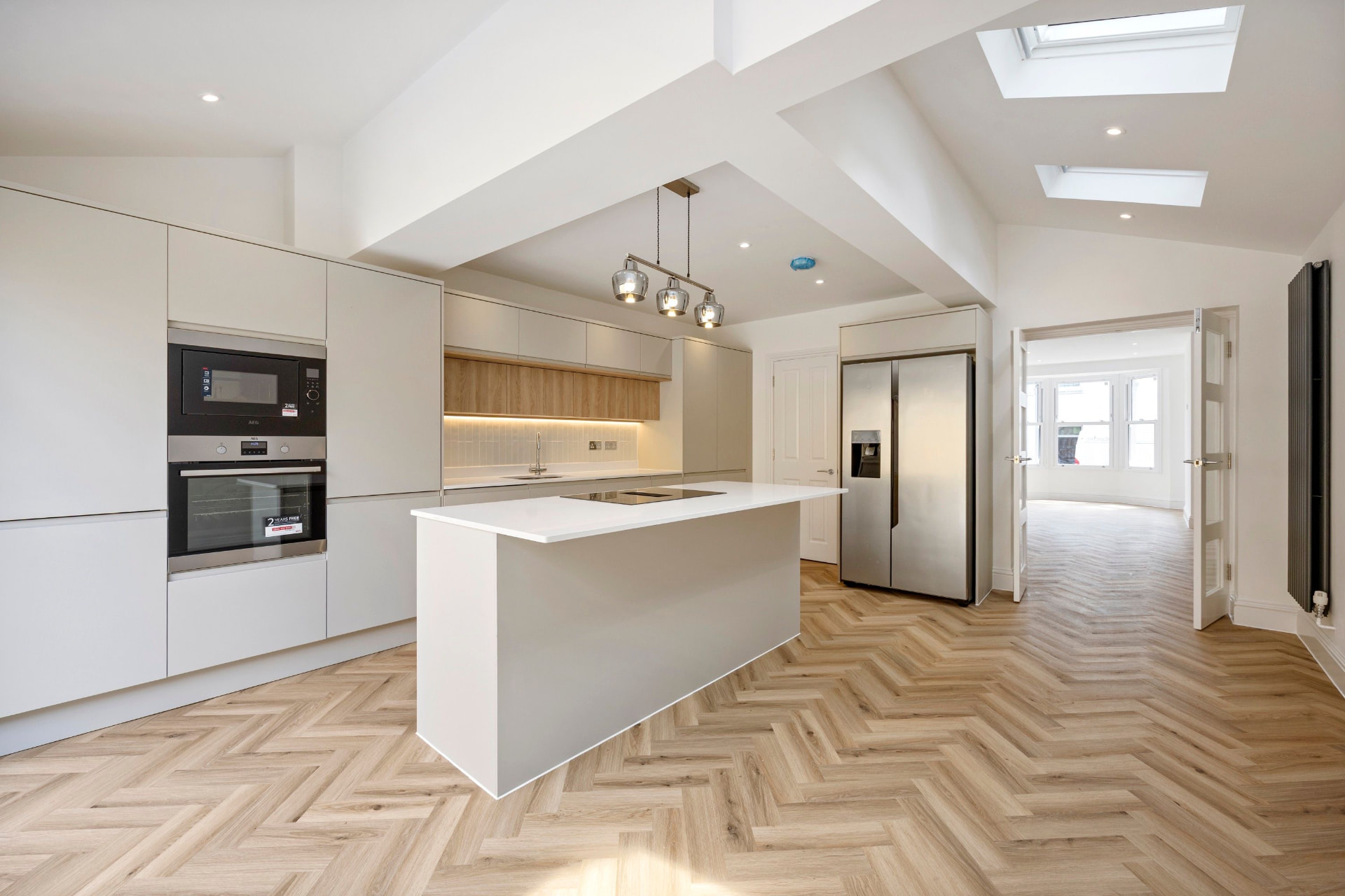 Fitted kitchen with slatted timber wall units